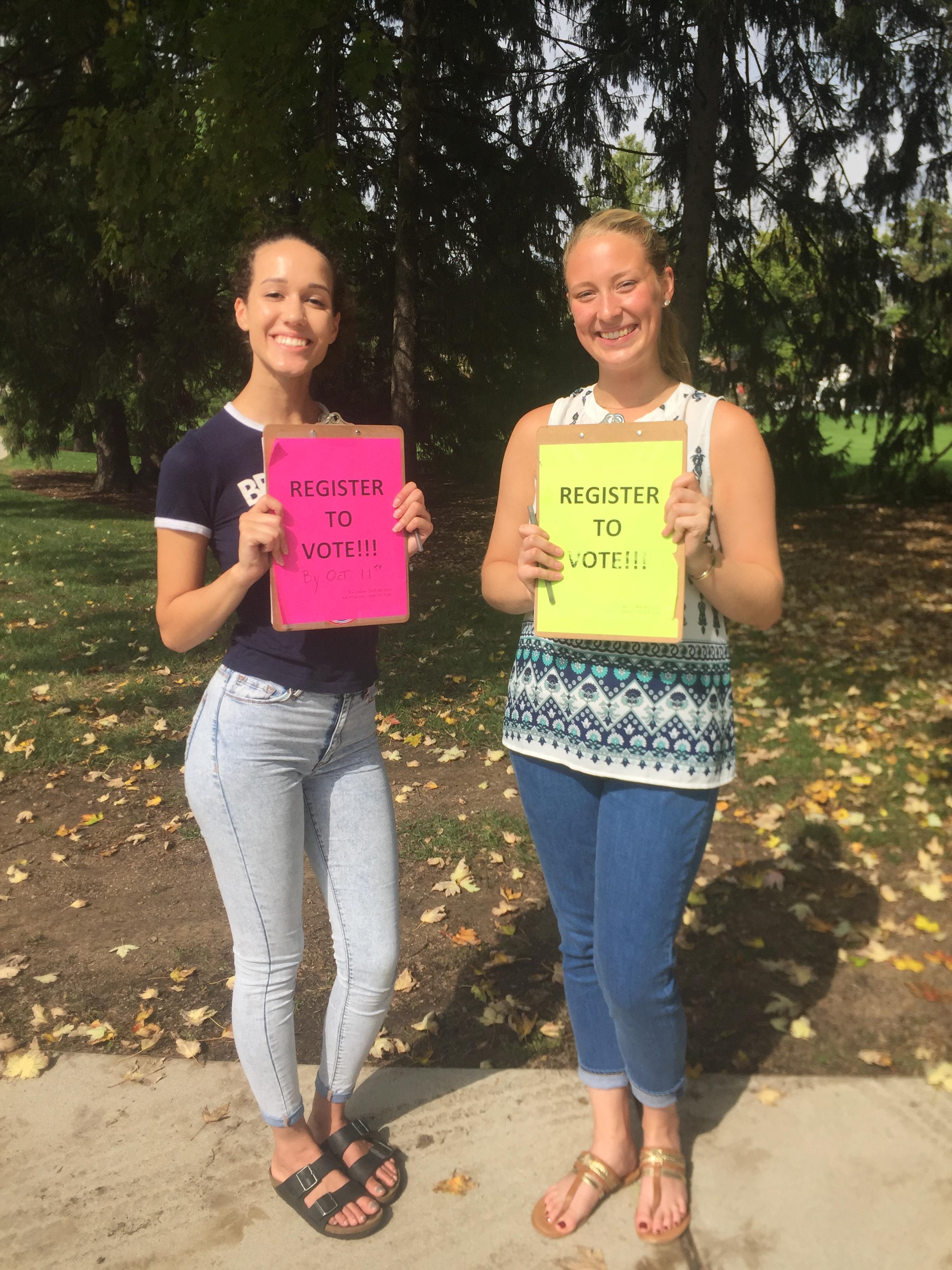 College students encouraging their peers to register to vote