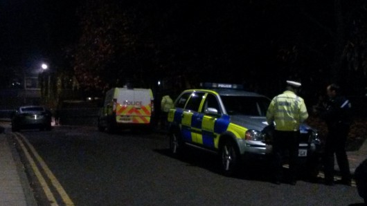 Police vehicles outside the Congregation Hall after the incident