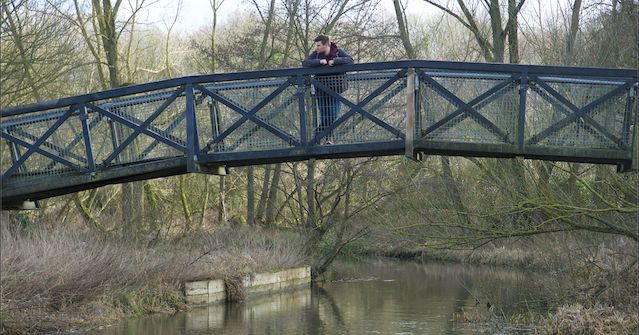 Image may contain: Architecture, River, Land, Plant, Vegetation, Nature, Water, Outdoors, Person, Human, Bridge, Building