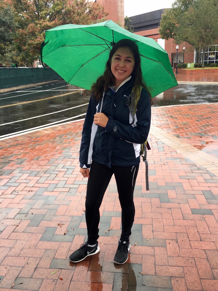 She called it the "just waking up" look, but she is sporting the most popular rainy trend at UF: rain jacket and athletic wear complimented by her cute umbrella.