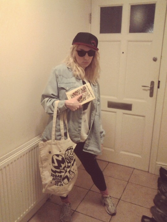 Oversize Levis shirt, check. Urban Outfitter swag, check. Sunglasses for no appropriate reason, check.
