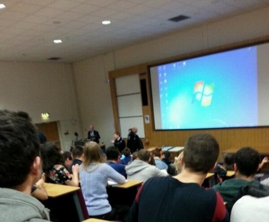 A picture appears to show security at the talk (via Twitter: @ERobson6)