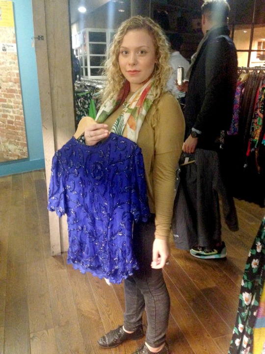 Emma Bailey, Second Year, Fashion Promotion, holding a COW top