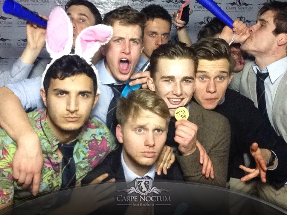 It must be hard to stay so stern in bunny ears and a Hawaiian shirt