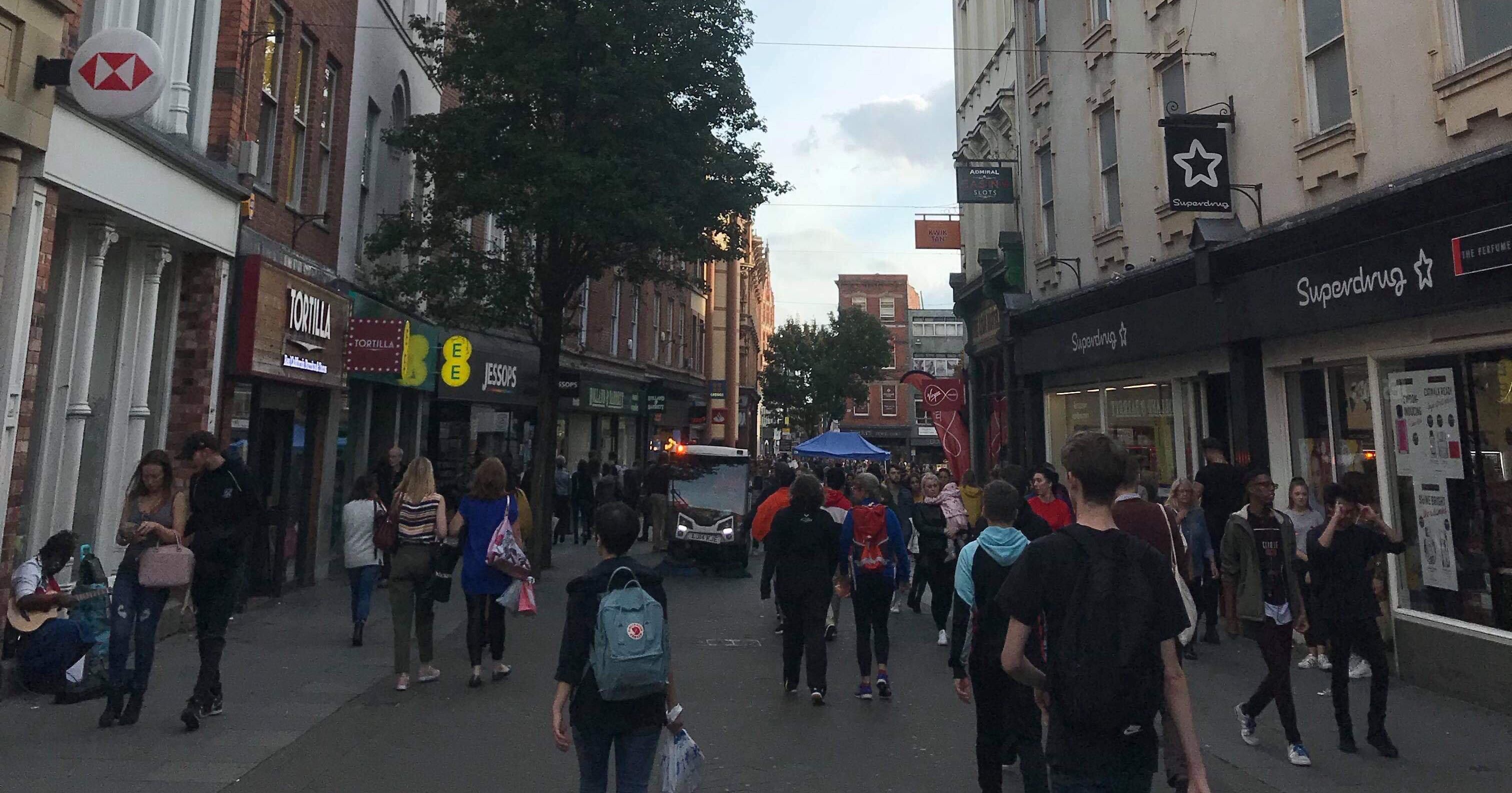 Image may contain: Road, Pants, Coat, Overcoat, Clothing, Apparel, Pedestrian, Human, Person