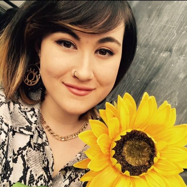 Image may contain: Sunflower, Blossom, Flower, Plant, Human, Person, Face