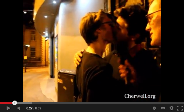 Drunken: Mather looks on as revellers make out