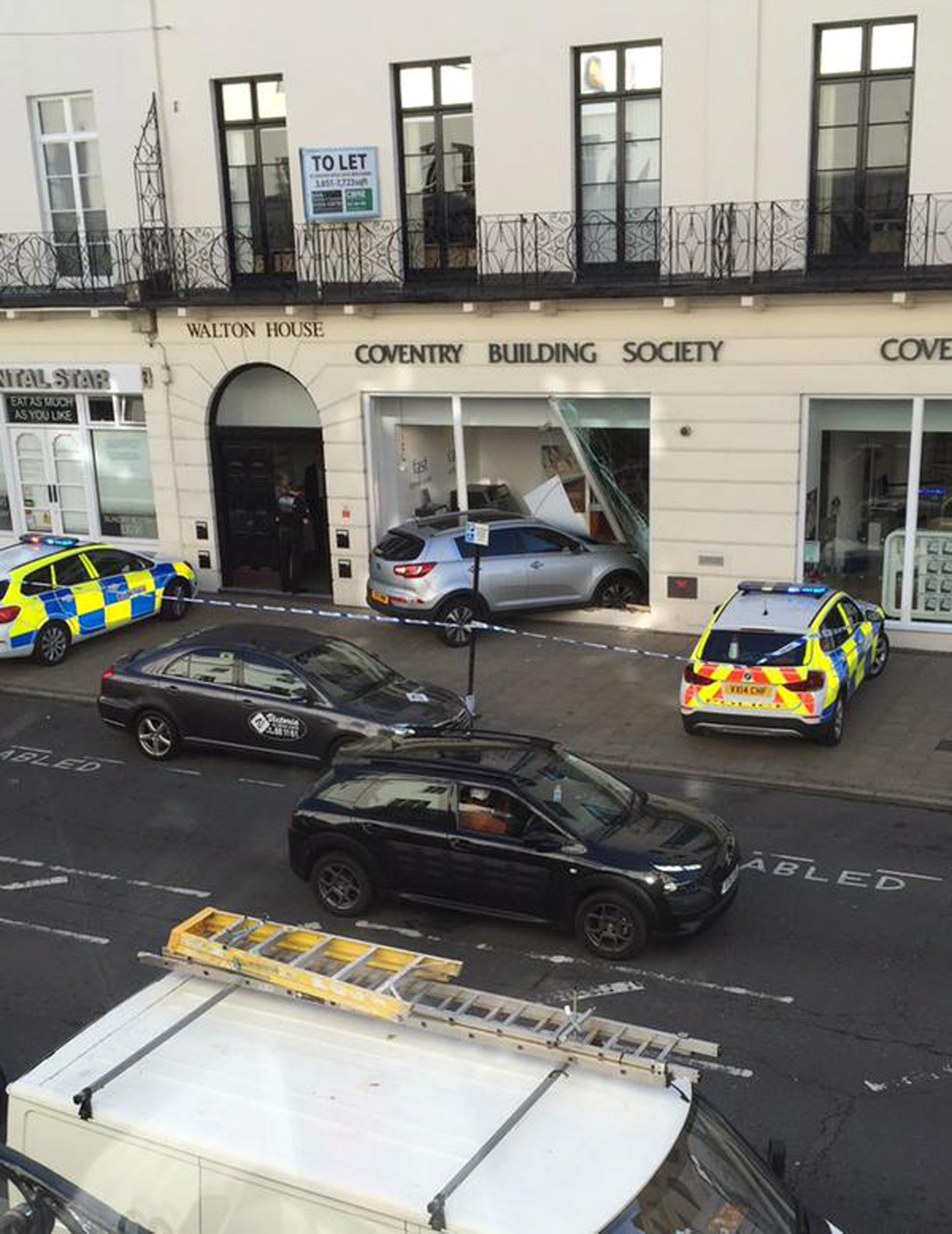 A car crashed through the window of Coventry Building SocietyÃs, Leamington town centre branch this morning. See NTI story NTIROBBERY. The incident happened shortly before 9am this morning as commuters made their way to work in the busy Leamington town centre. A grey Kia smashed through the front window of the building societyÃs upper Parade branch. Warwickshire Police are at the scene, but nobody has been arrested and it is not yet known if anyone has been injured. A spokesman for Warwickshire Police said: "We were called just after 8.30am to reports of a robbery at Coventry Building Society on the Parade, in Leamington Spa. Officers are currently at the scene dealing with the incident."