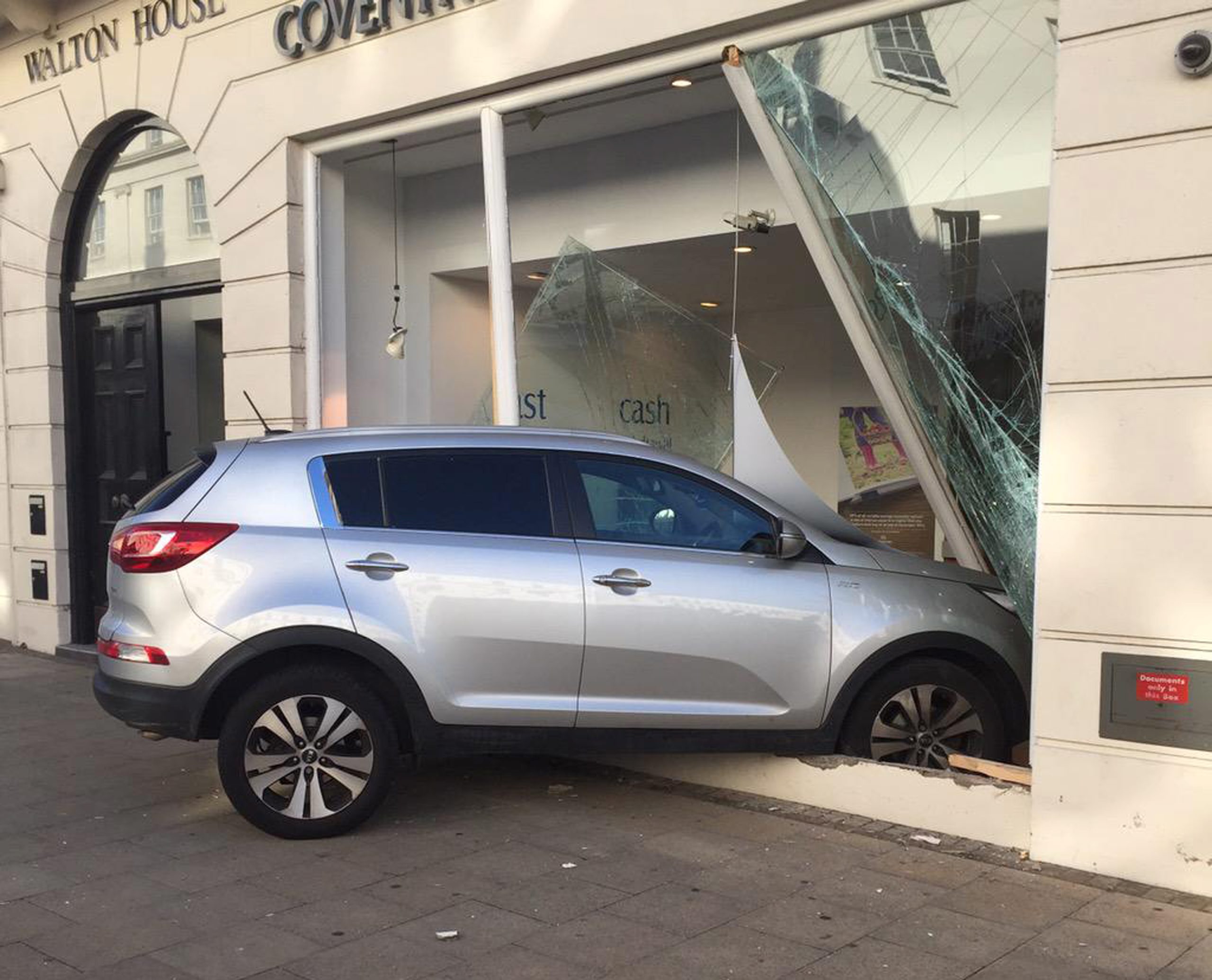 A car crashed through the window of Coventry Building SocietyÃs, Leamington town centre branch this morning. See NTI story NTIROBBERY. The incident happened shortly before 9am this morning as commuters made their way to work in the busy Leamington town centre. A grey Kia smashed through the front window of the building societyÃs upper Parade branch. Warwickshire Police are at the scene, but nobody has been arrested and it is not yet known if anyone has been injured. A spokesman for Warwickshire Police said: "We were called just after 8.30am to reports of a robbery at Coventry Building Society on the Parade, in Leamington Spa. Officers are currently at the scene dealing with the incident."