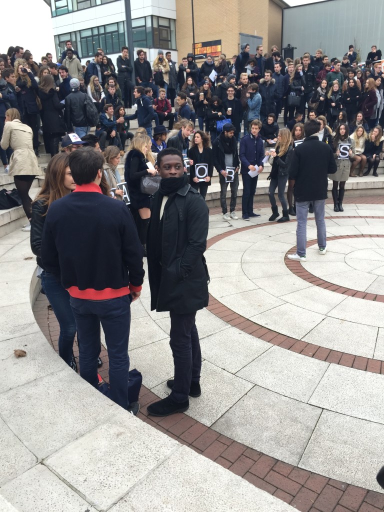 Getting ready to hold up the message 'Strong for Paris'.