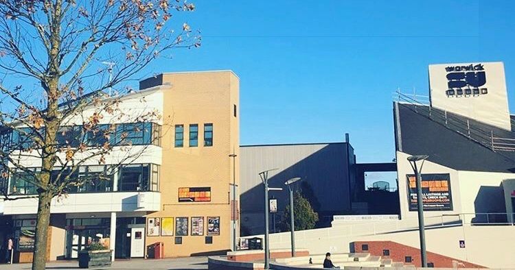 Image may contain: Vase, Pottery, Potted Plant, Plant, Jar, Flora, Urban, Neighborhood, Building, Sign