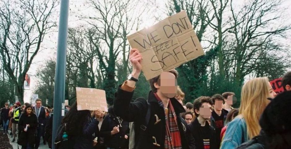 Image may contain: Skirt, Vegetation, Plant, Protest, Tartan, Plaid, Parade, Face, Crowd, Text, Apparel, Clothing, Person, Human