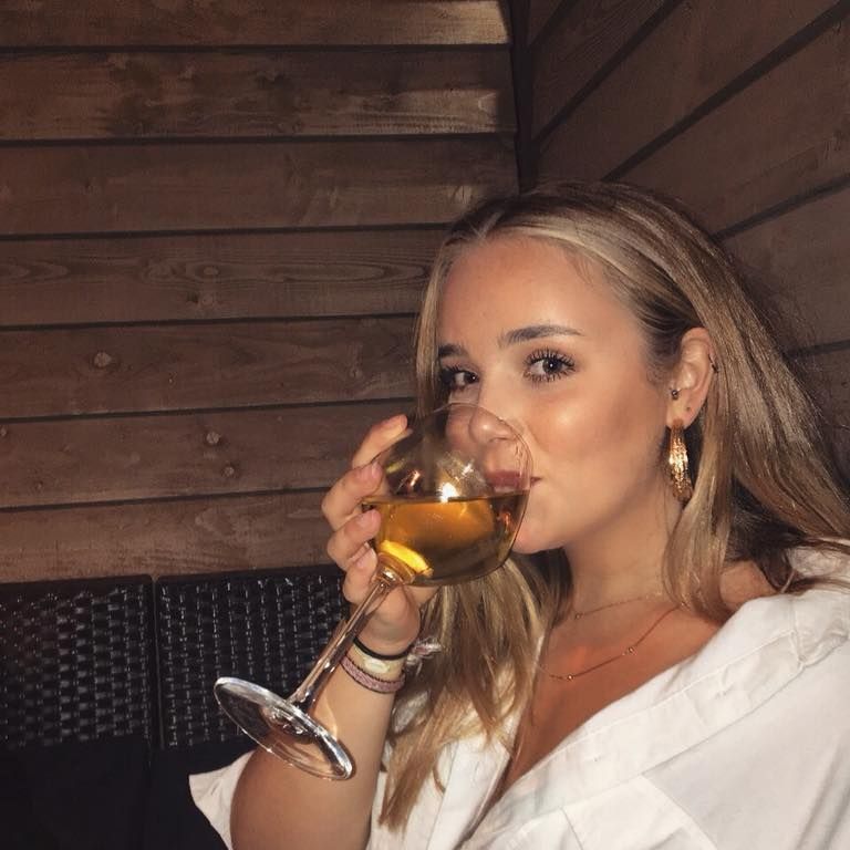 Image may contain: Finger, Wood, Alcohol, Drinking, Glass, Dating, Drink, Beverage, Person, Human