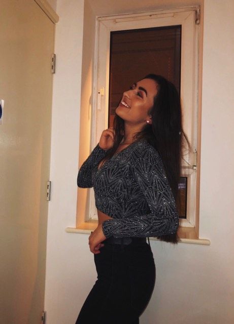 Image may contain: Pants, Blouse, Face, Woman, Long Sleeve, Female, Door, Person, Human, Clothing, Apparel, Sleeve