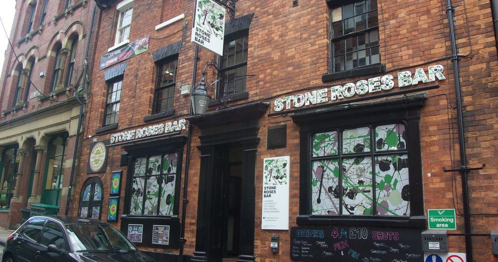 Image may contain: Shop, Apartment Building, Window, Neighborhood, City, High Rise, Town, Building, Urban, Brick, Transportation, Car, Automobile, Vehicle