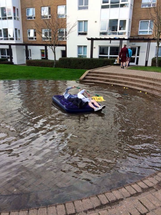 John and his flatmate sailing on the giant pond in Pendle college.