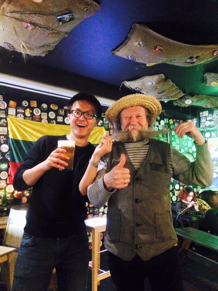 That's him enjoying his beer with a bearded guy at a local bar in Alaus barai "Šnekutis", Lithuania.