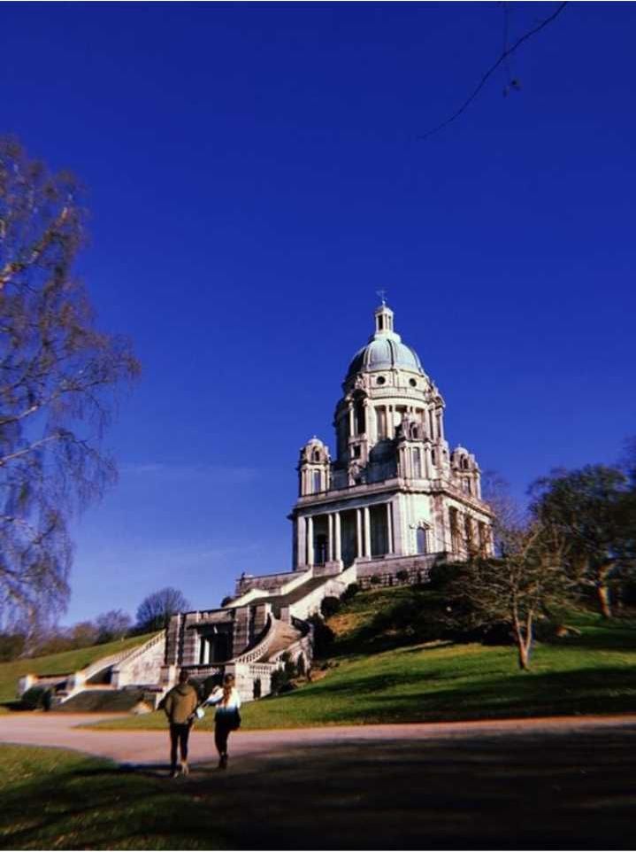 Image may contain: Housing, Bell Tower, Church, Cathedral, Outdoors, Tower, Spire, Steeple, Dome, Grass, Plant, Architecture, Building, Person, Human