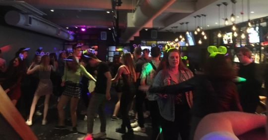 Image may contain: Party, Disco, Lighting, Night Life, Footwear, Apparel, Shoe, Clothing, Night Club, Club, Person, Human