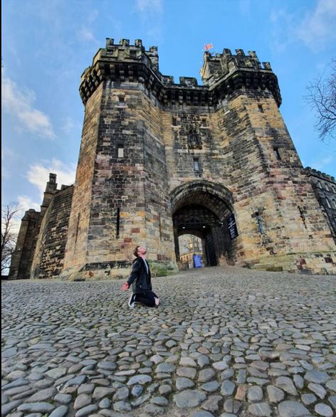 Image may contain: Cobblestone, Fort, Sidewalk, Pavement, Human, Person, Architecture, Building, Castle, Walkway, Path