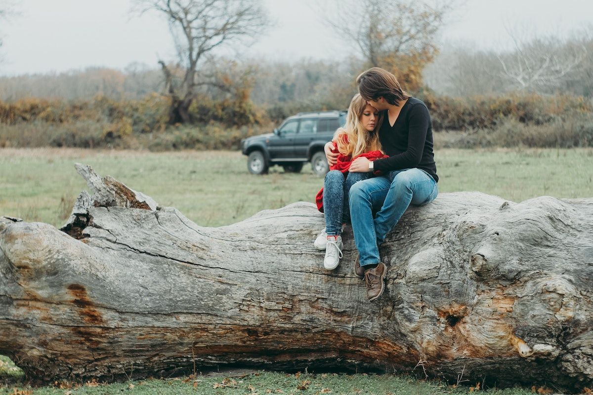 Image may contain: Grass, Tree, Plant, Automobile, Vehicle, Transportation, Car, Machine, Wheel, Sitting, Wood, Jeans, Denim, Shoe, Footwear, Person, Human, Clothing, Pants, Apparel