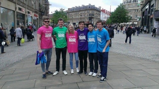 Adam (second left) and fellow supporters giving 'good gestures'. Much better than a cake sale.