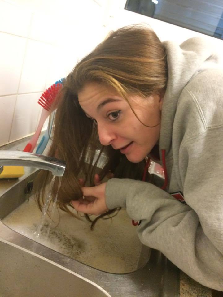 Tass, 21, is close to washing her hair with kettle water in the sink.