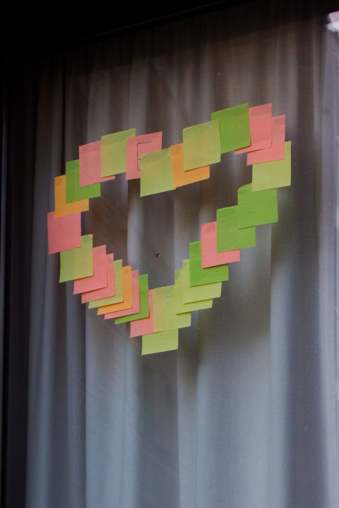 A love heart presented in multicoloured Post-It notes.