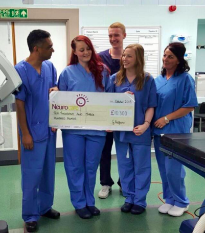 Georgina presenting the cheque