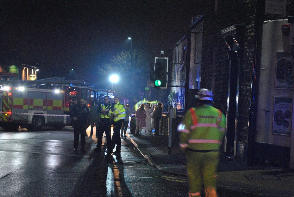 Evacuated residents huddled in dressing gowns.