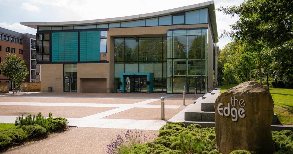 Image may contain: Urban, Town, High Rise, City, Building, Apartment Building, Hedge, Fence, Yew, Tree, Plant, Flora, Conifer