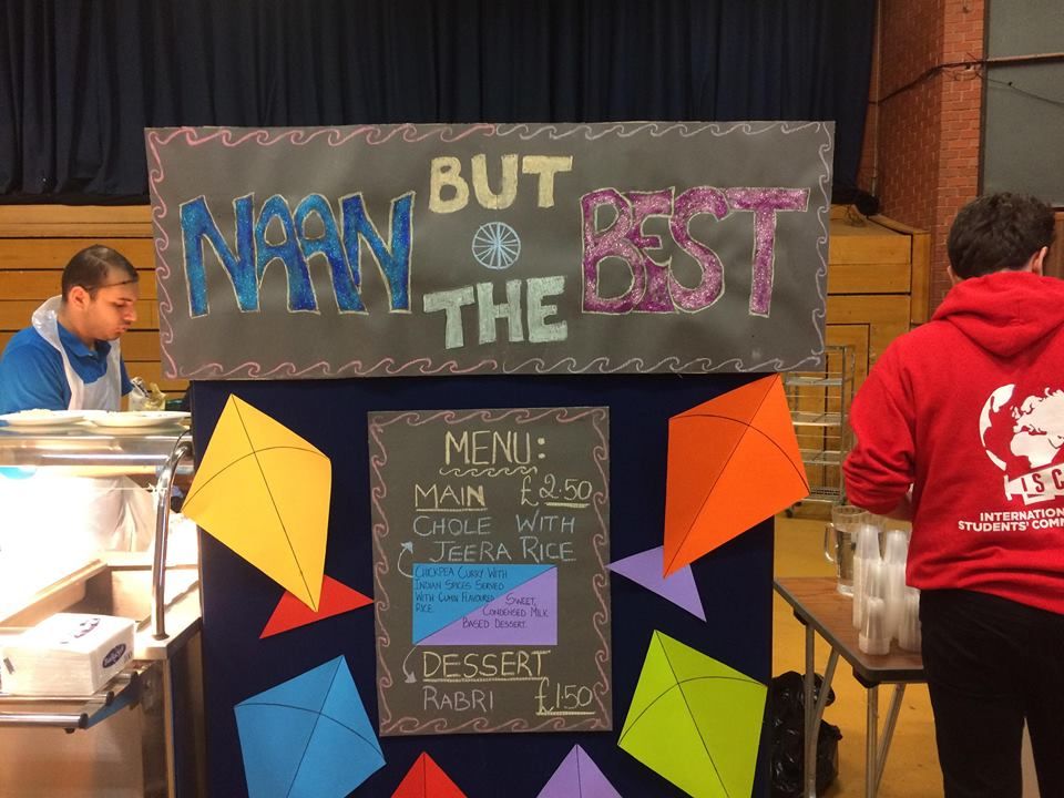 Image may contain: Room, Indoors, Classroom, Paper, Clothing, Apparel, Blackboard, Person, People, Human