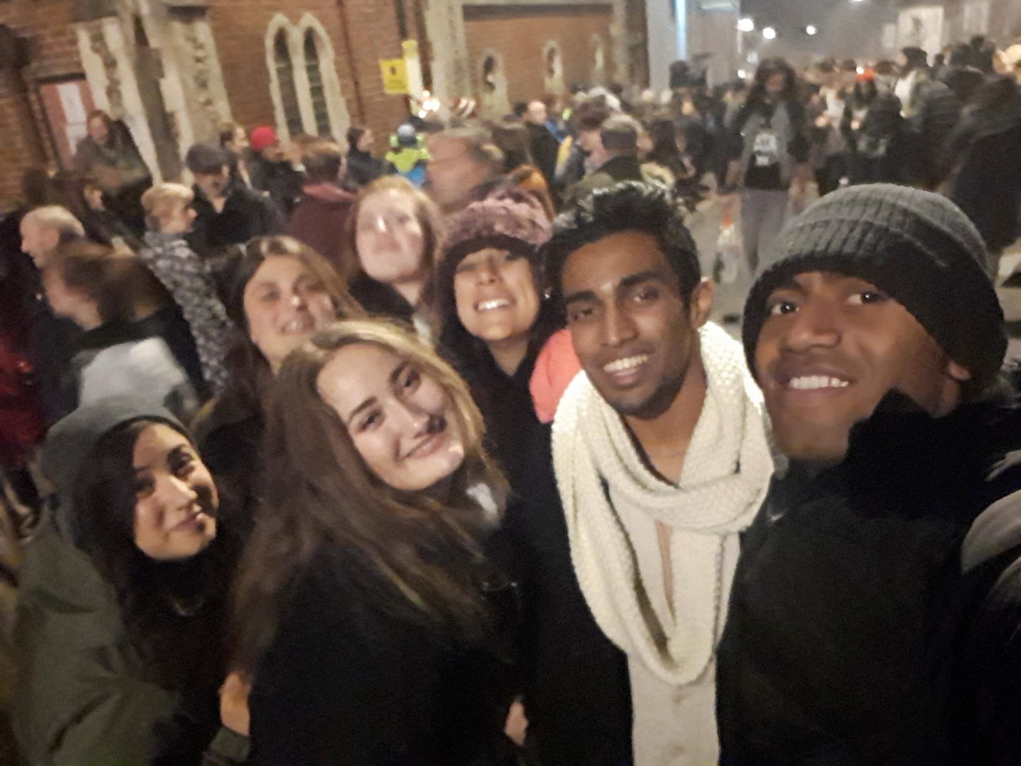 Image may contain: Hat, Cap, Beanie, Crowd, Human, Person, People