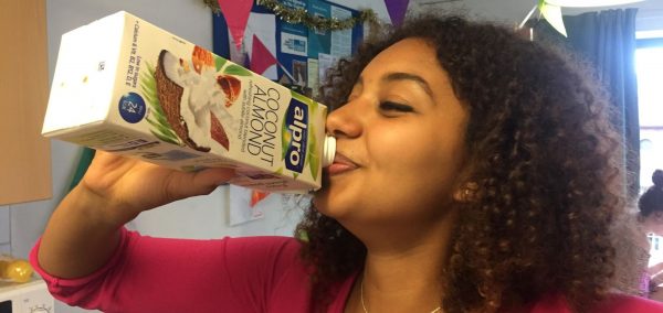 Image may contain: Book, Hair, Afro Hairstyle, Person, People, Human