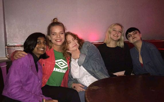 Image may contain: Meal, Food, Teen, Kid, Child, Blonde, Girl, Woman, Couch, Furniture, Pants, People, Interior Design, Indoors, Female, Party, Smile, Face, Apparel, Clothing, Person, Human