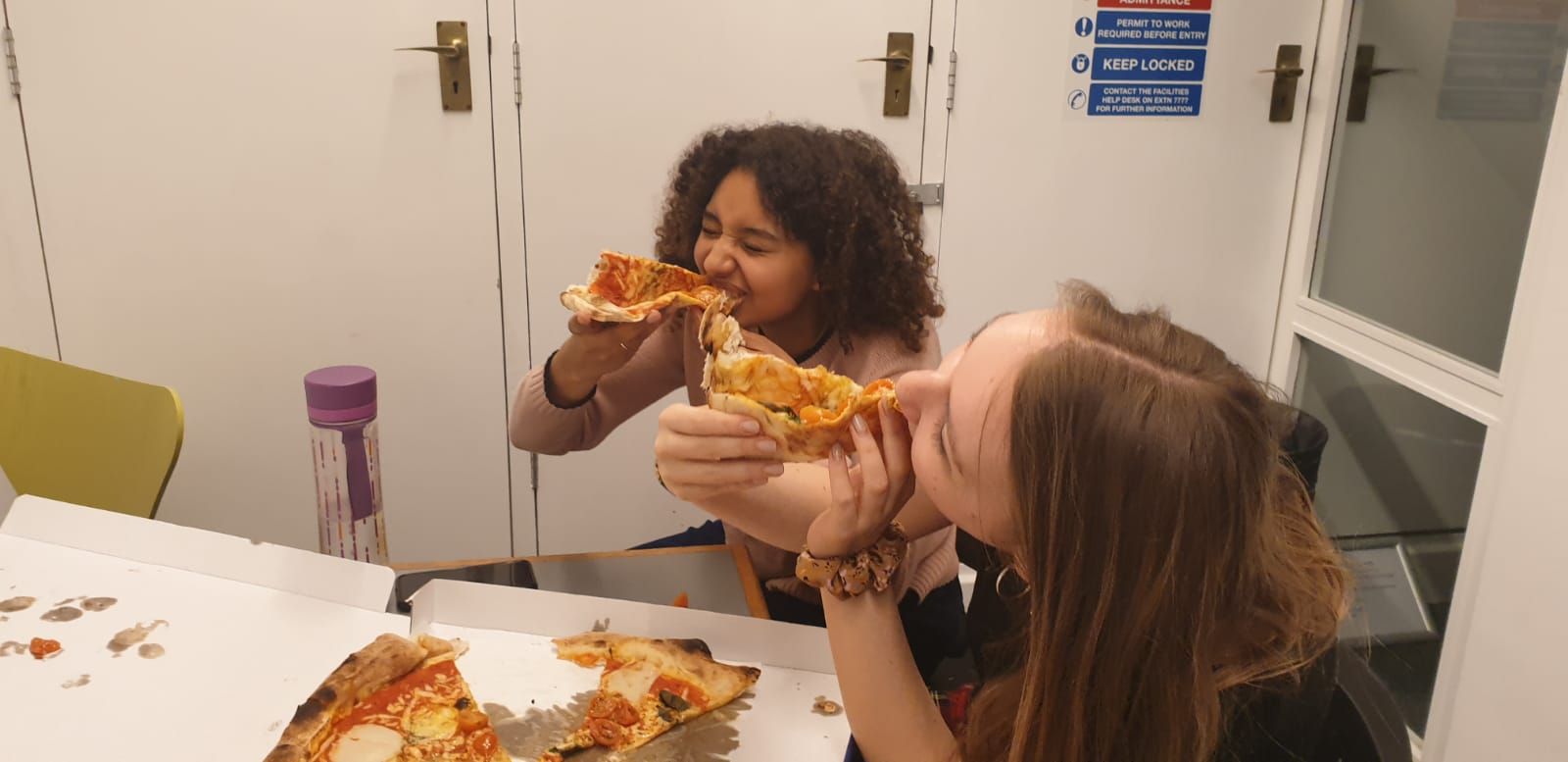 Image may contain: Hair, Eating, Pizza, Food, Person, Human