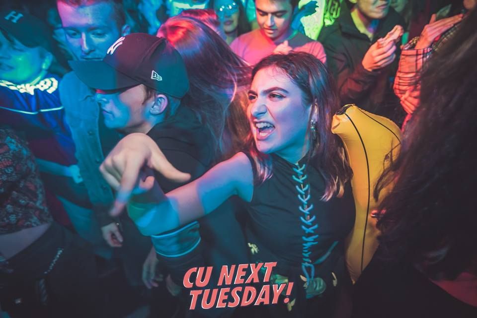 Image may contain: Disco, Apparel, Hat, Clothing, Night Club, Club, Party, Human, Person