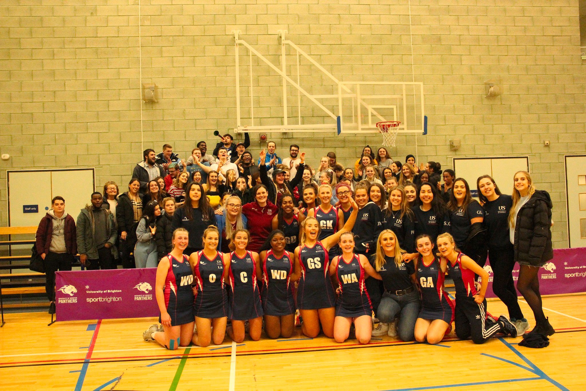 Image may contain: Indoors, Apparel, Clothing, Flooring, Sphere, Crowd, Team, Sports, Team Sport, Sport, People, Person, Human