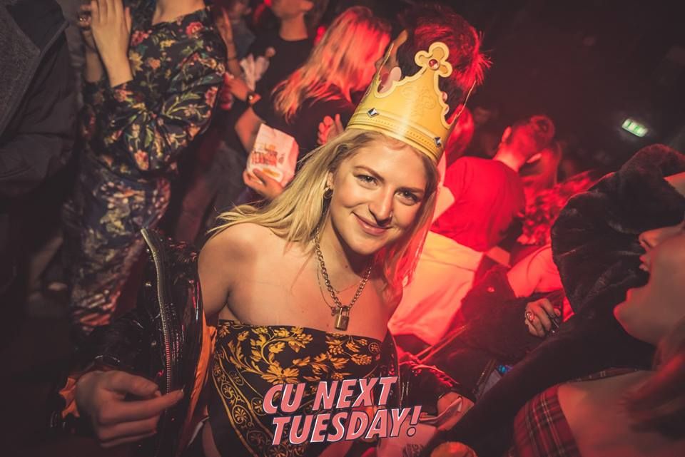 Image may contain: Party Hat, Hat, Night Life, Apparel, Clothing, Night Club, Club, Human, Person, Party