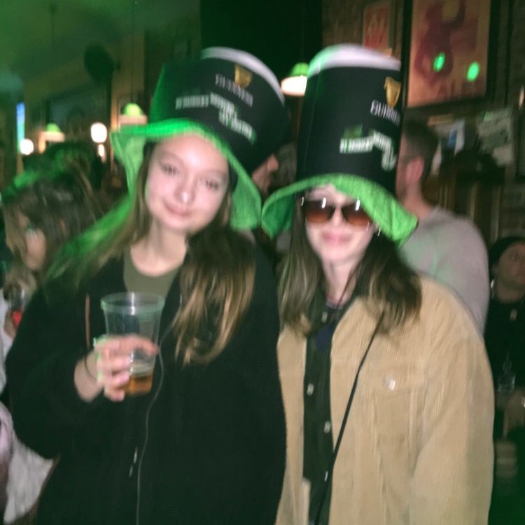 Image may contain: Female, Alcohol, Bar Counter, Head, Pub, Smile, Night Club, Drink, Beverage, Hat, Club, Face, Party, Night Life, Accessories, Accessory, Sunglasses, Apparel, Clothing, Human, Person