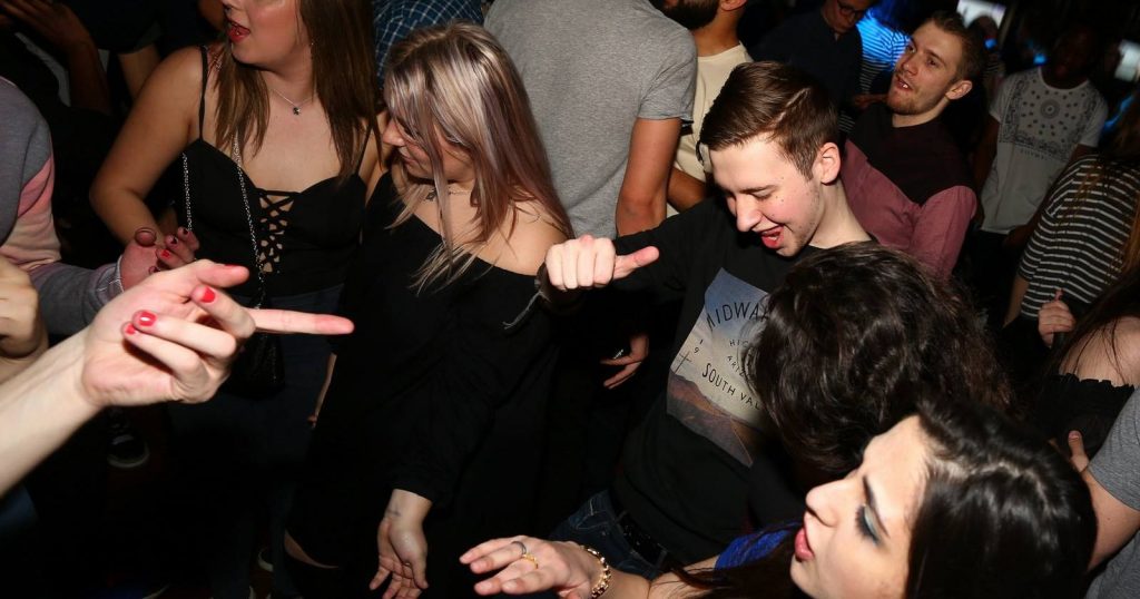 Image may contain: Pub, Night Life, Night Club, Party, Club, Human, Person