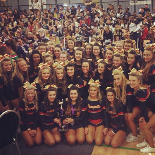 all the cheerleading squad with the trophie