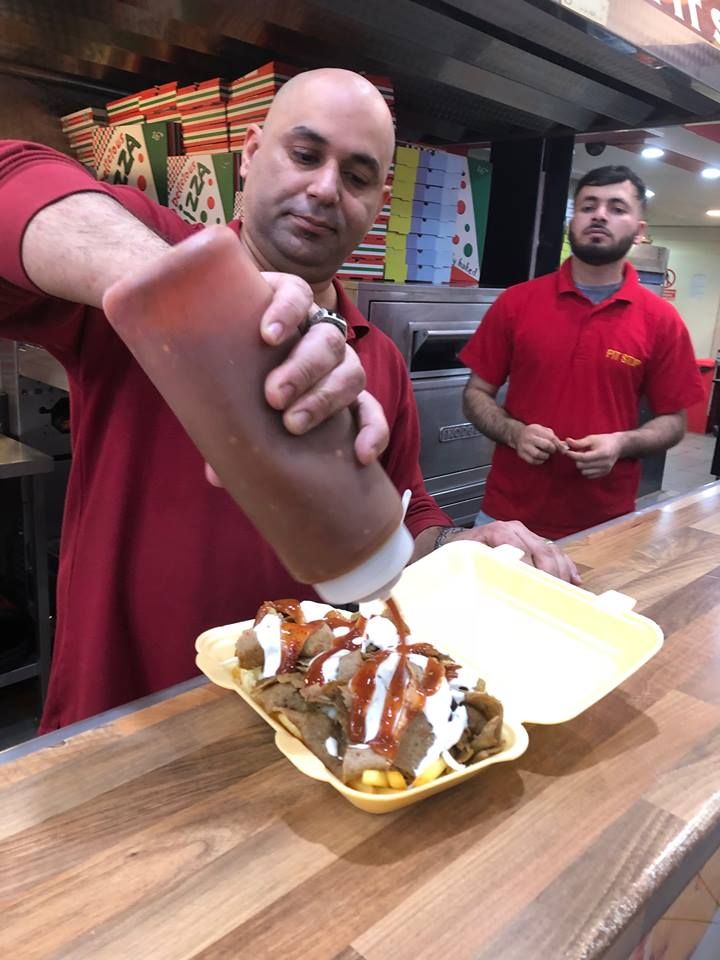 Image may contain: Meal, Food, Wood, Human, Person