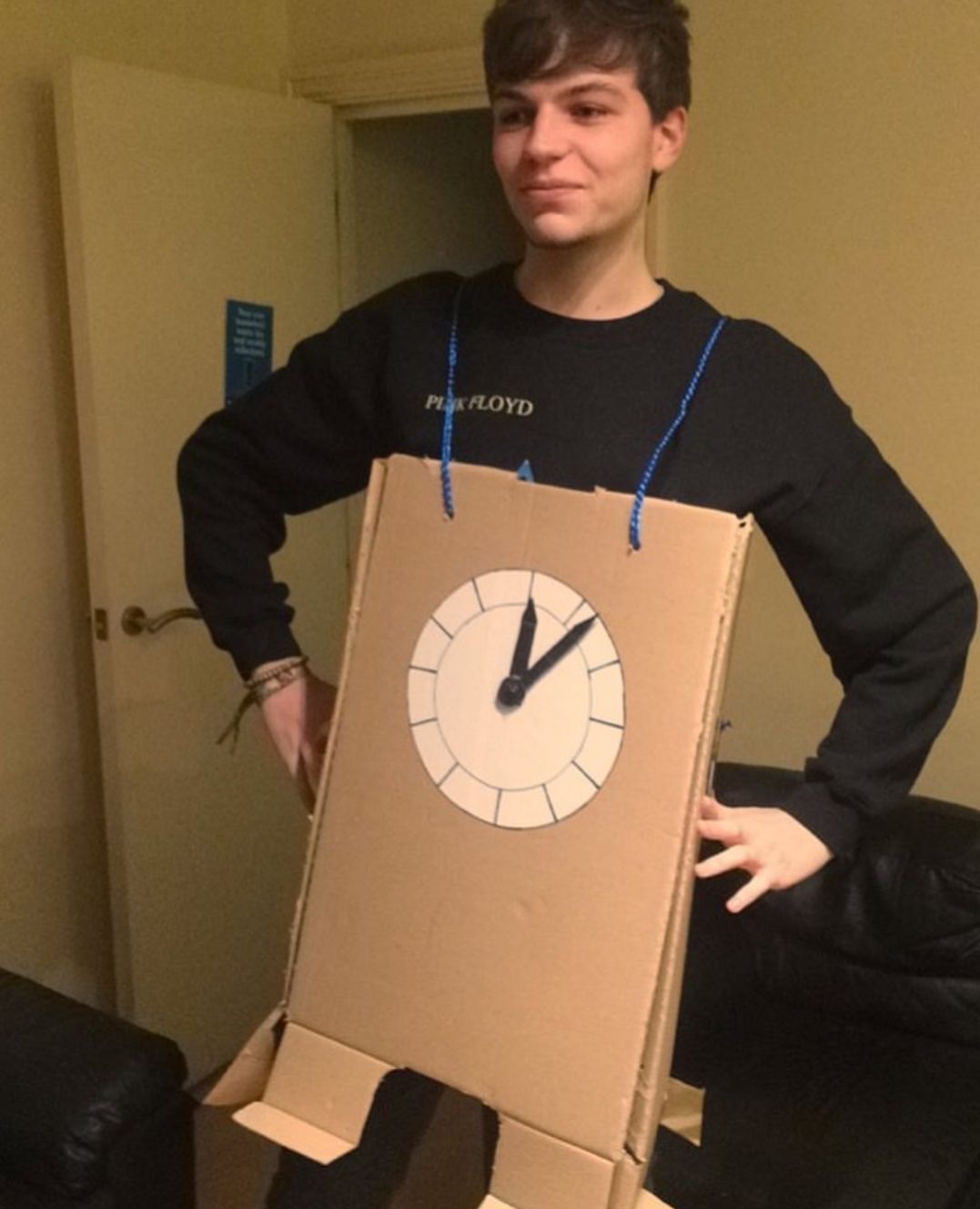 Image may contain: Pants, Cardboard, Wood, Plywood, Apparel, Clothing, Architecture, Clock Tower, Tower, Building, Person, Human