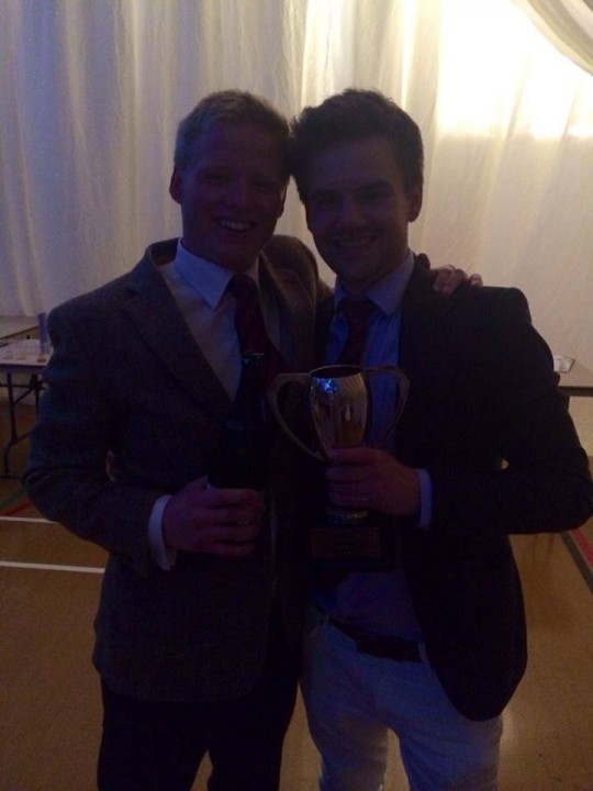 Dave Trim shows off his trophy for the camera