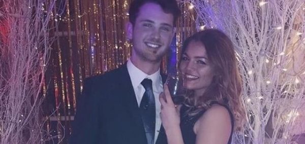 Image may contain: Jacket, Blazer, Woman, Necklace, Jewelry, Man, Dress, Accessory, Accessories, Female, Smile, Face, Person, Human, Tuxedo, Apparel, Coat, Overcoat, Suit, Clothing