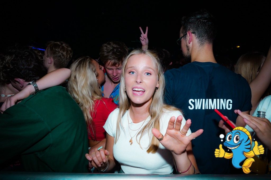 Image may contain: Crowd, Finger, Night Life, Night Club, Party, Club, Human, Person