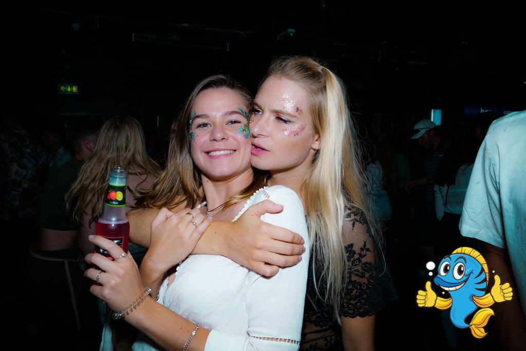 Image may contain: Party, Beer, Bottle, Beverage, Drink, Alcohol, Night Life, Night Club, Club, Skin, Person, Human