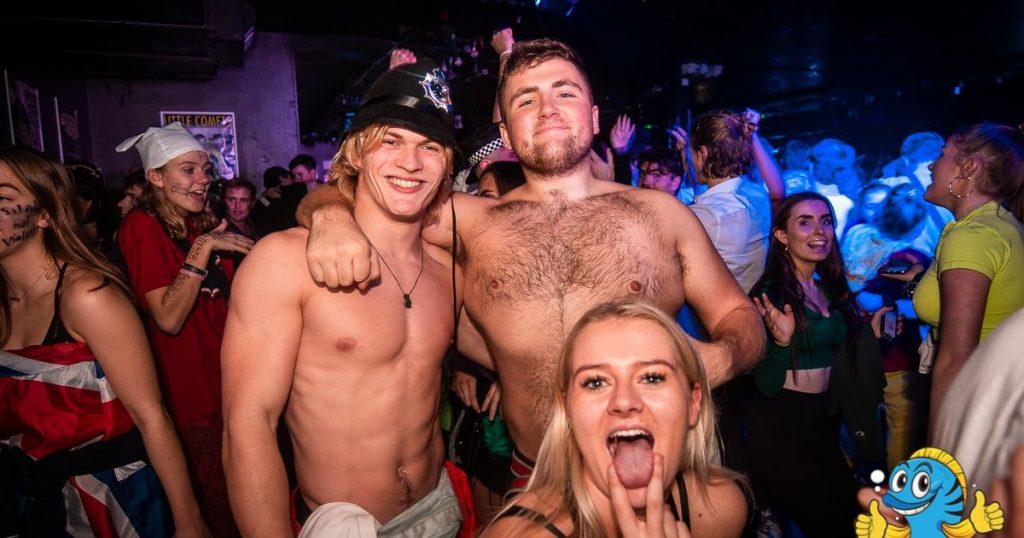 Image may contain: Crowd, Night Club, Face, Club, Night Life, Party, Human, Person, Skin