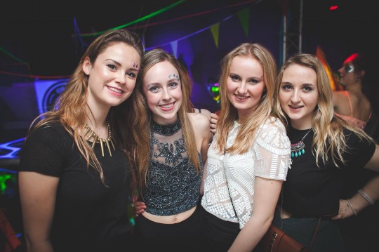 These ladies are rocking a more understated look, but their embellished tops still give them an air of decadence.
